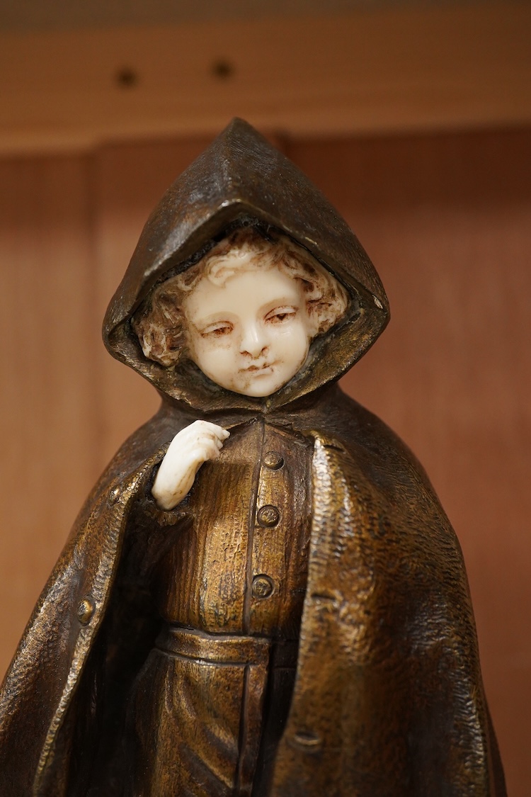 An Art Deco bronze and ivory figure of a boy wearing a cloak, signed Chopard, 22cm high CITES Submission reference, B3J6ULYT